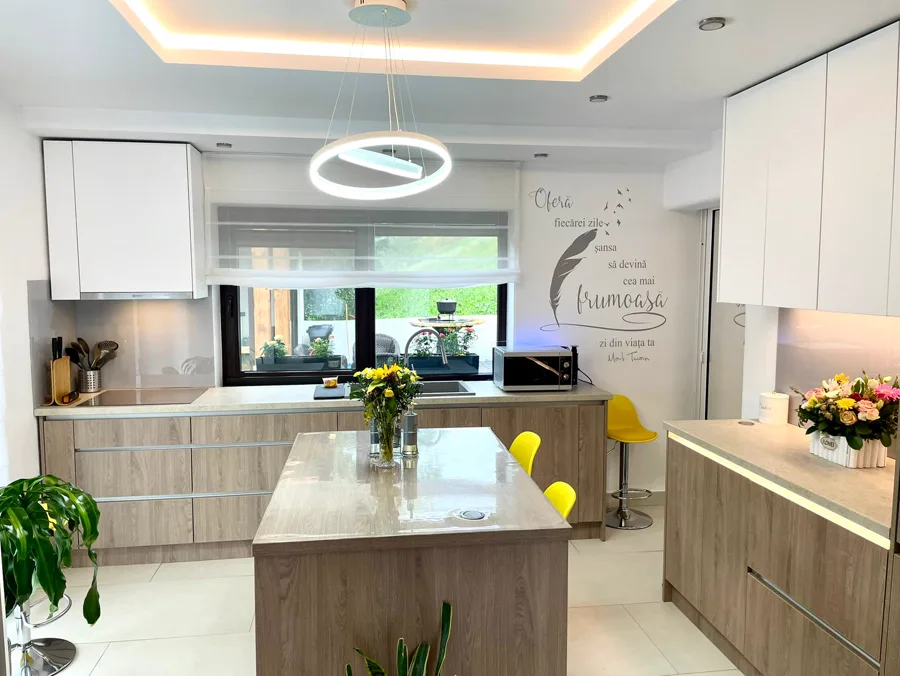 Modern kitchen with island and mustard yellow bar stools